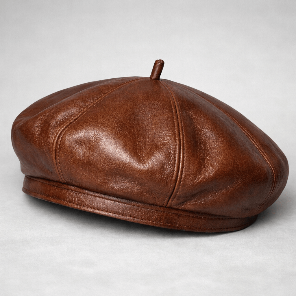 Brown leather beret hat with stitched panels and small top stem